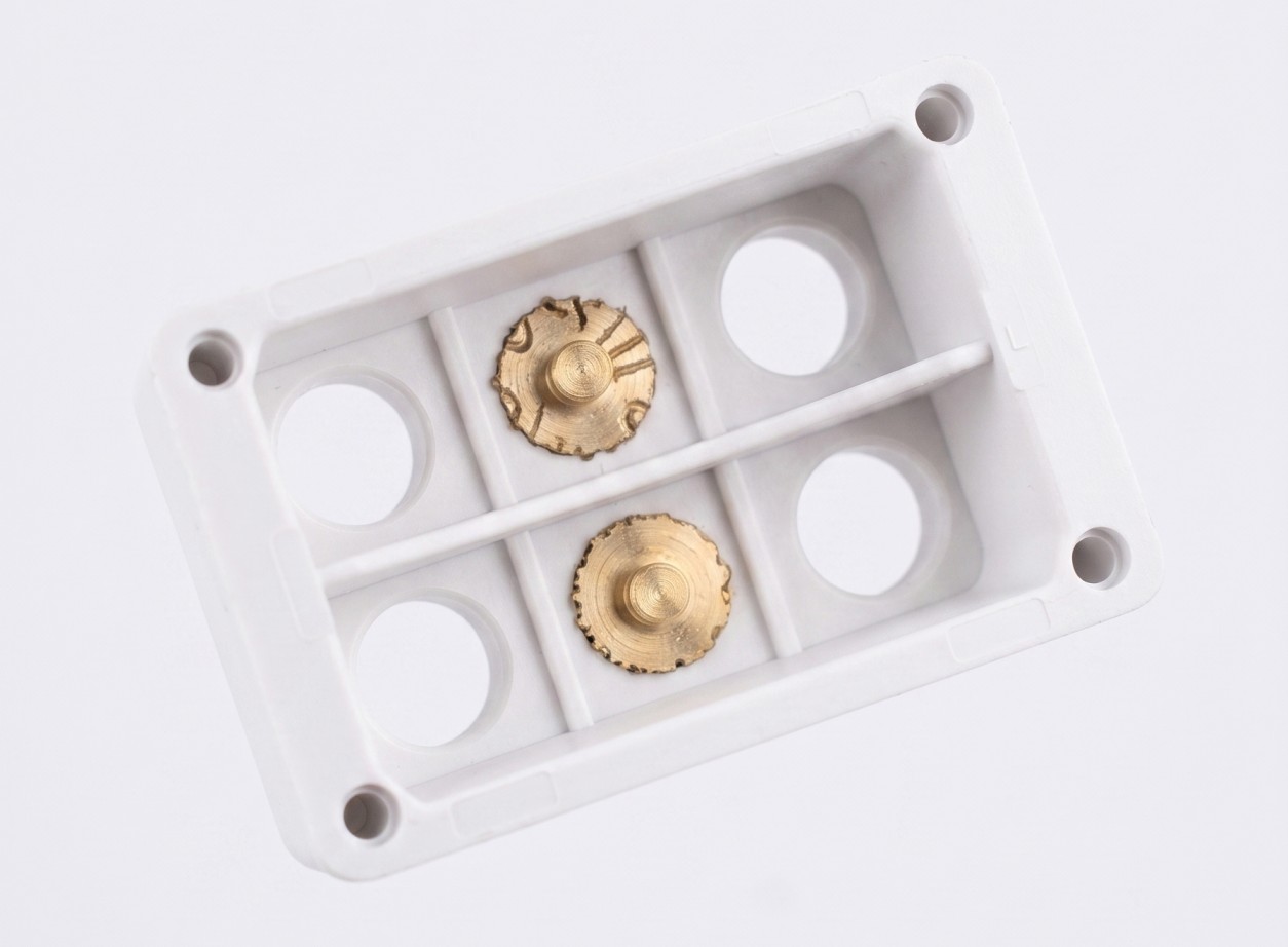 Brass threaded insert installed in plastic part